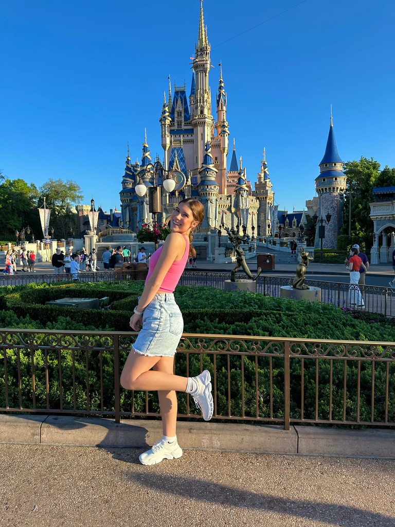 Kendyll posing in front of Cinderella Castle at Walt Disney World