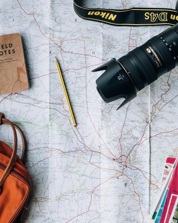 Travel planning — maps, passport, and adventure essentials